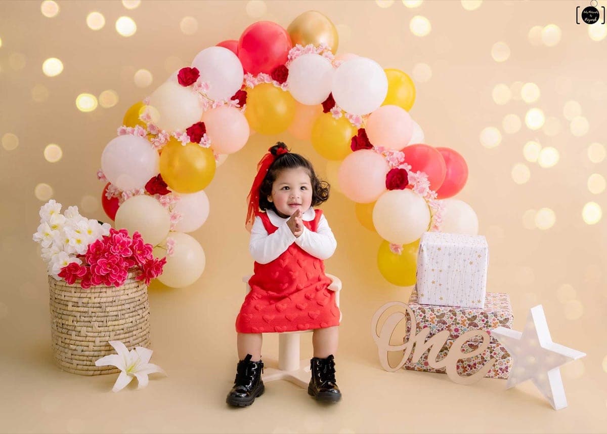 A happy 8-month-old baby boy during his sitter session in our Gurgaon studio, captured by professional baby photographer Priyansh Bhardwaj.