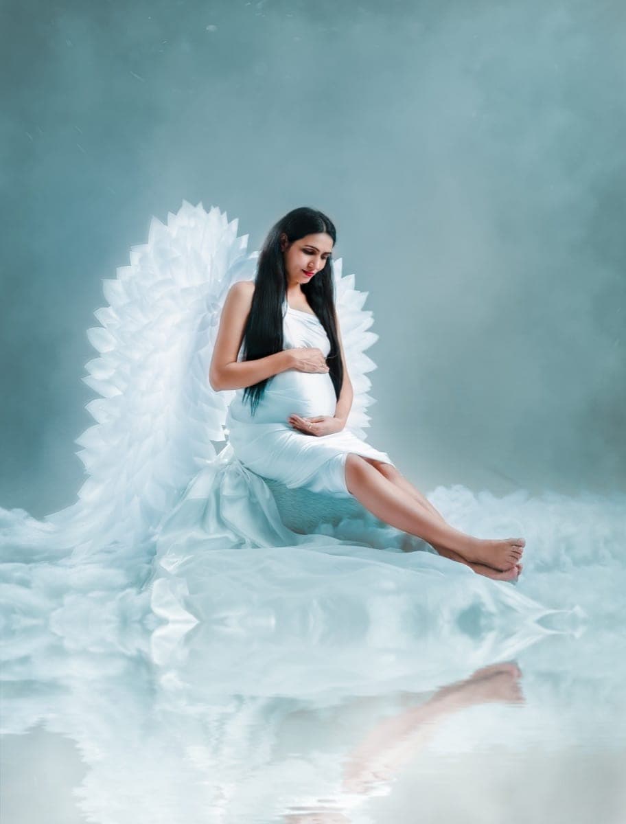 Maternity gown styling and elegant posing during a maternity session in Delhi NCR by Priyansh Bhardwaj.